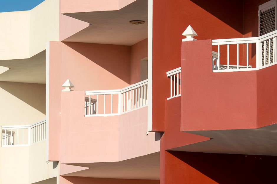 Painted house walls in several colours.